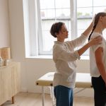 Physical Therapist Giving a Massage to a Woman 